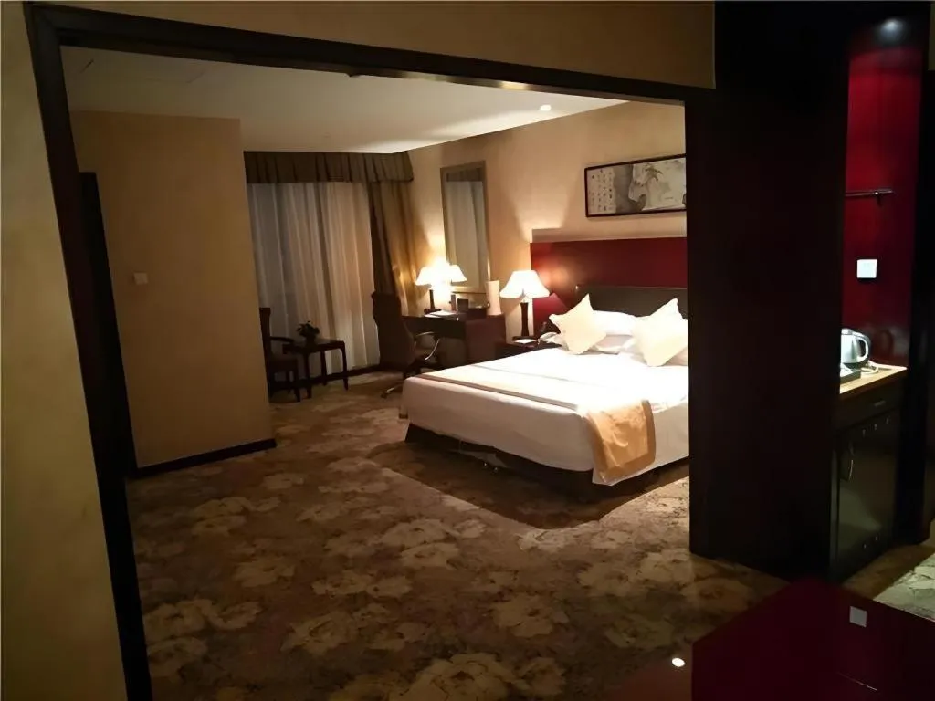 Bed in Zhong Yi Peng Ao Hotel