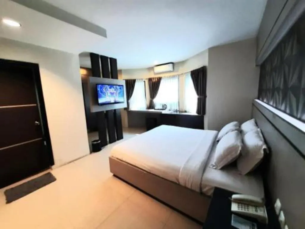 Bed in Alexander Hotel Tegal