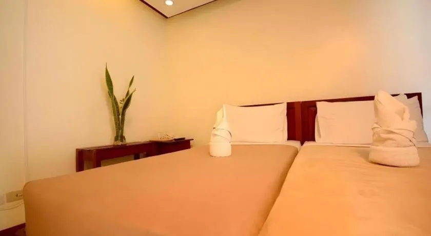 Bed in Ipil Suites El Nido