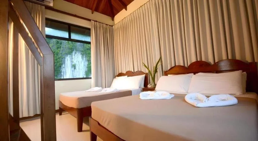 Bed in Ipil Suites El Nido