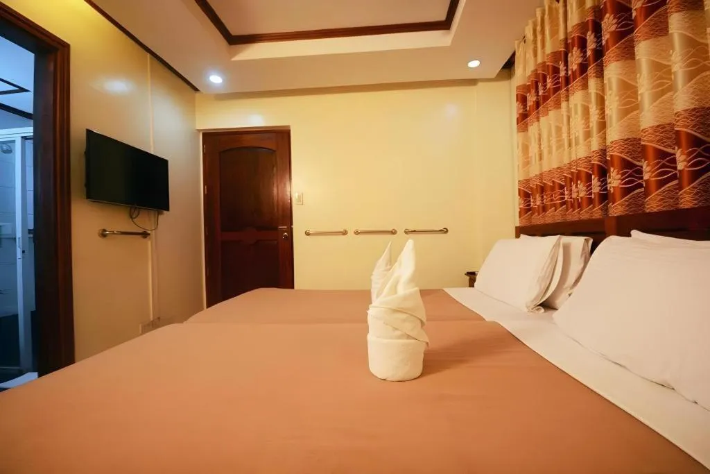 Bed in Ipil Suites El Nido
