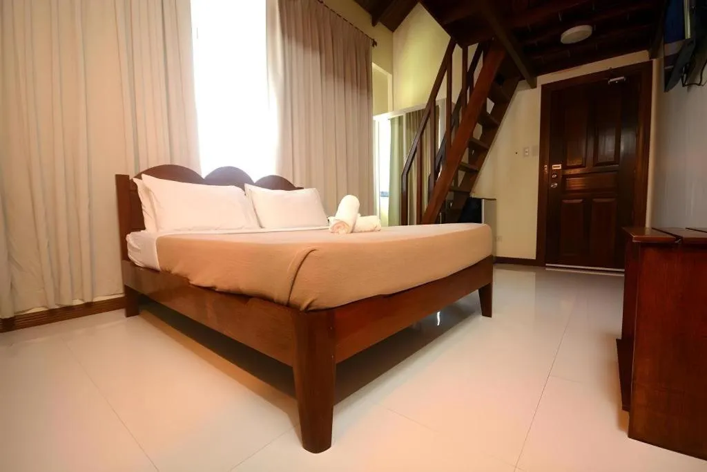 Bed in Ipil Suites El Nido
