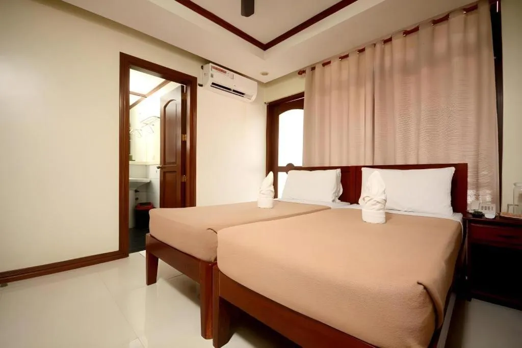 Bed in Ipil Suites El Nido