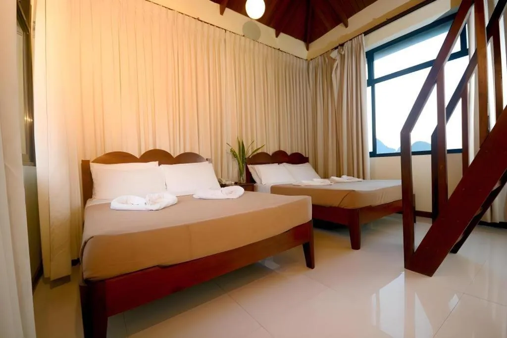 Bed in Ipil Suites El Nido