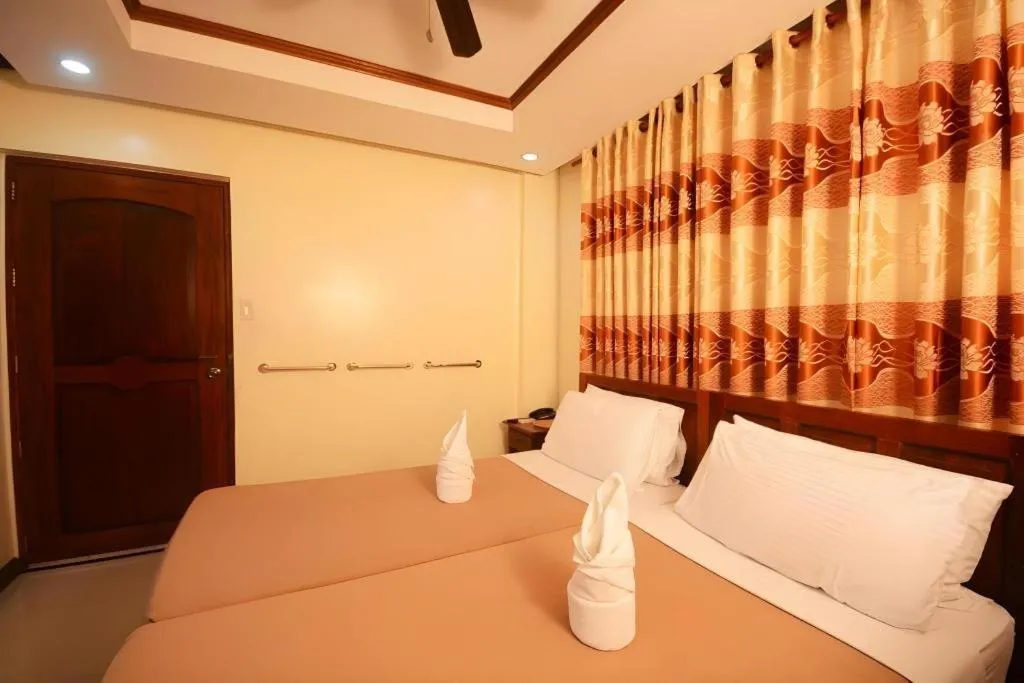 Bed in Ipil Suites El Nido