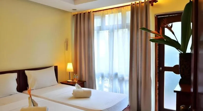 Bed in Ipil Suites El Nido