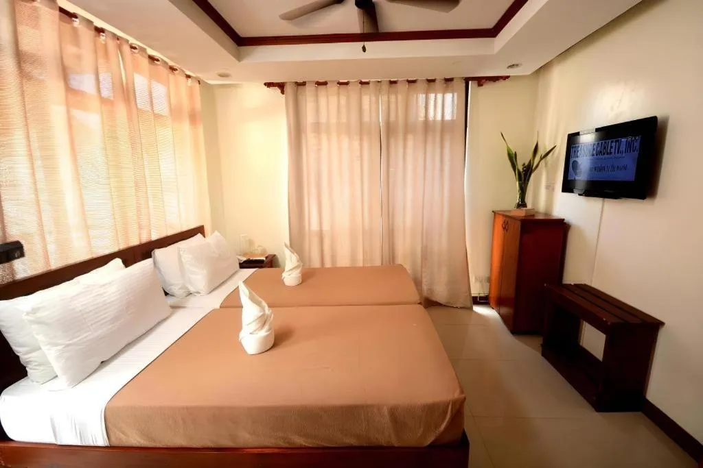 Bed in Ipil Suites El Nido