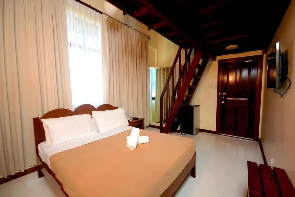 Bed in Ipil Suites El Nido