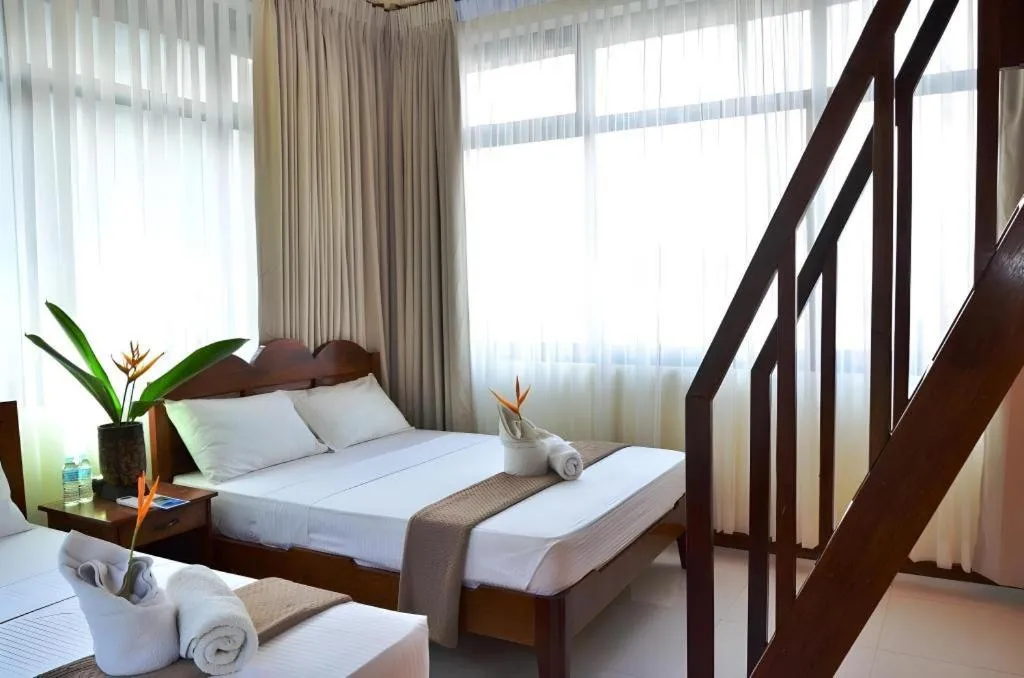 Bed in Ipil Suites El Nido