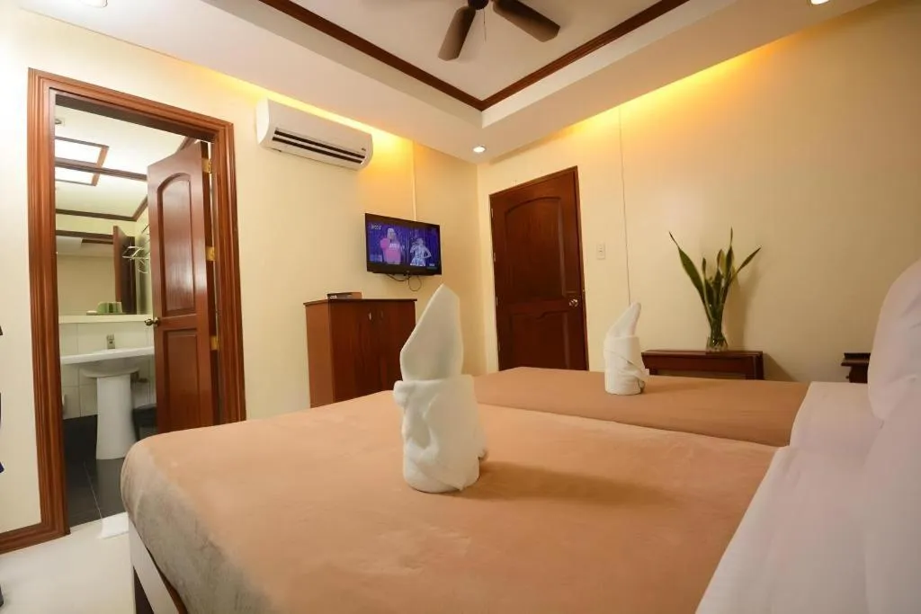 Bed in Ipil Suites El Nido