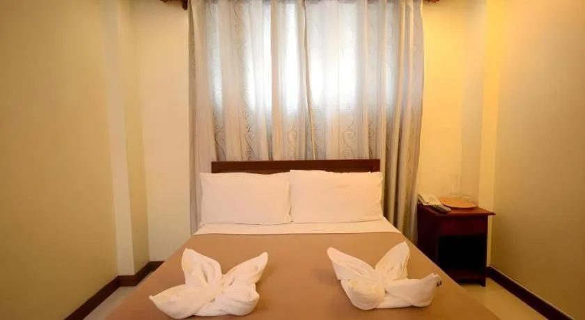Bed in Ipil Suites El Nido
