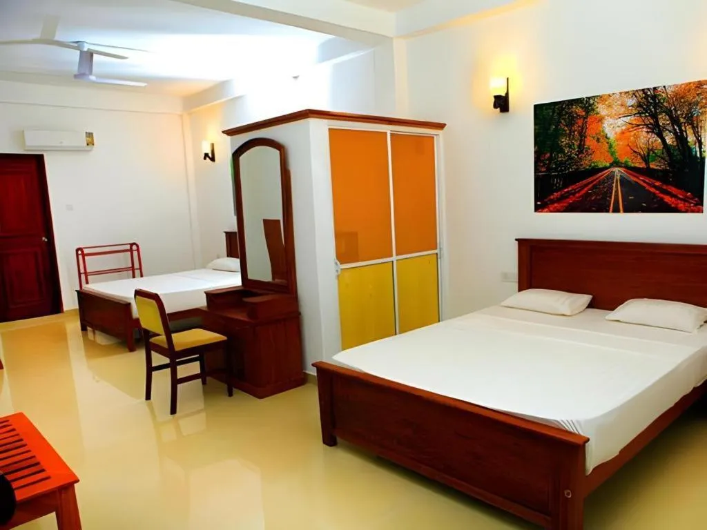 Bed in OYO 246 Roy Villa Beach Hotel