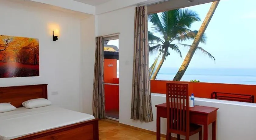 Bed in OYO 246 Roy Villa Beach Hotel