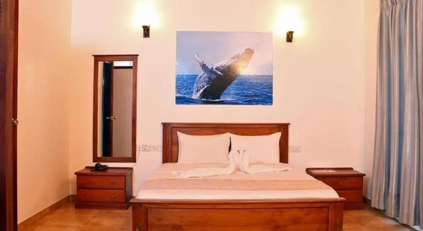 Bed in OYO 246 Roy Villa Beach Hotel