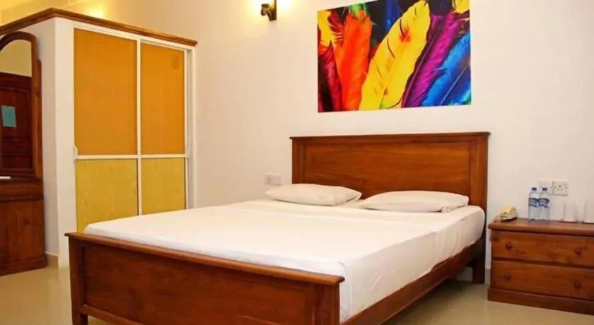 Bed in OYO 246 Roy Villa Beach Hotel
