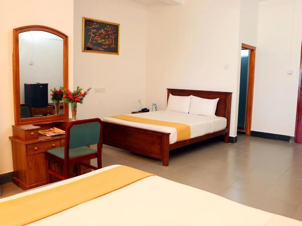 Bed in OYO 246 Roy Villa Beach Hotel