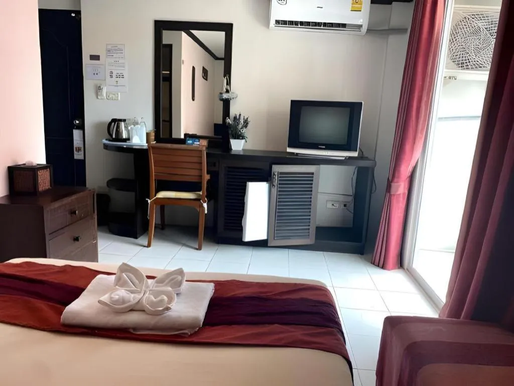 Bed in The Nice Patong Hotel