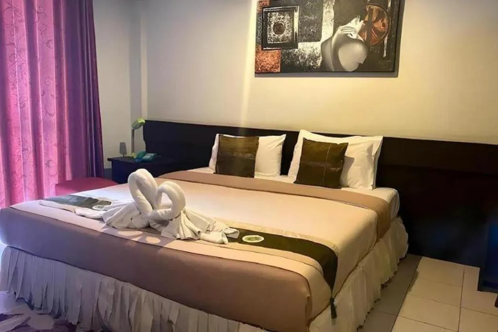 Bed in The Nice Patong Hotel