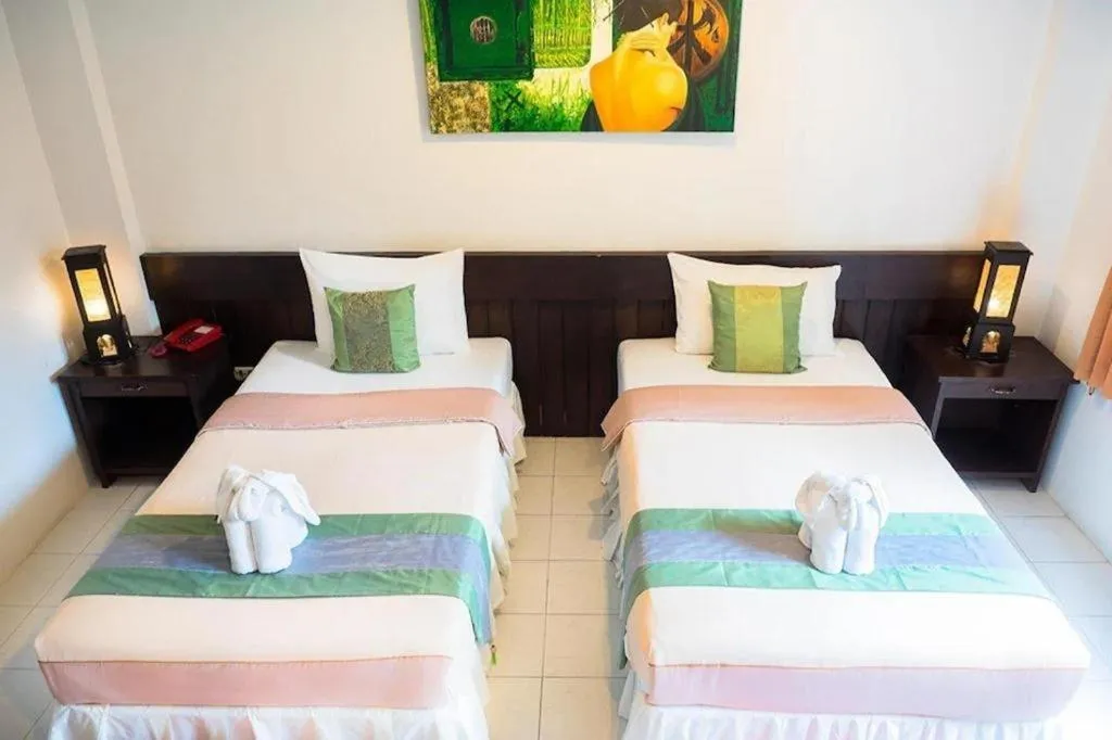 Bed in The Nice Patong Hotel