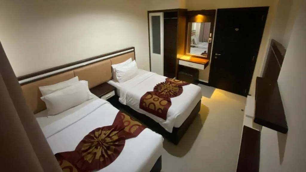 Bed in The BCC Hotel & Residence