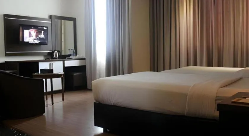 Bed in The BCC Hotel & Residence