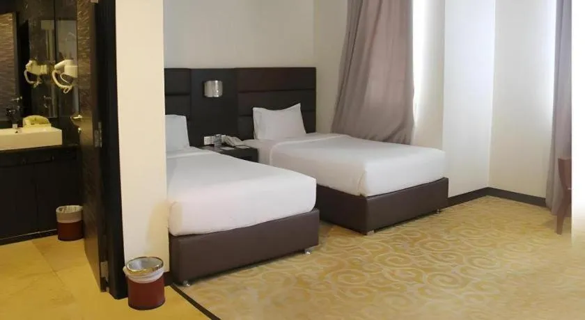 Bed in The BCC Hotel & Residence