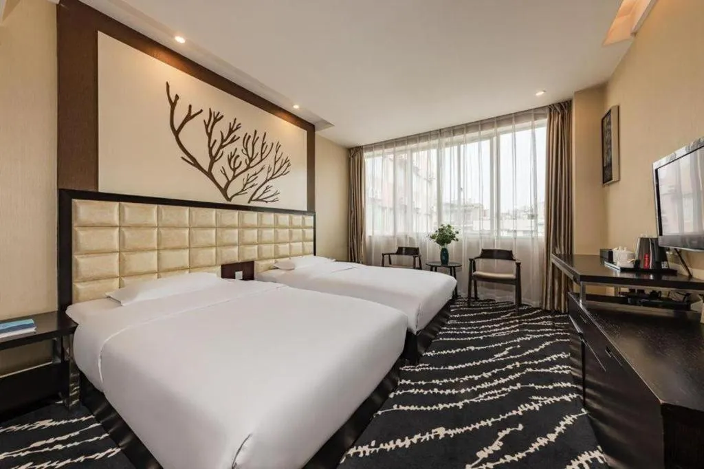 Bed in Kunming Long Way Hotel