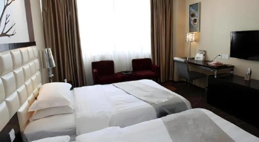 Bed in Kunming Long Way Hotel