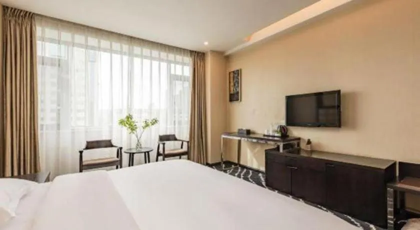 Bed in Kunming Long Way Hotel