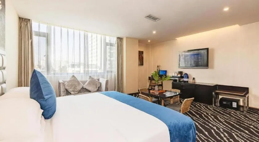 Bed in Kunming Long Way Hotel