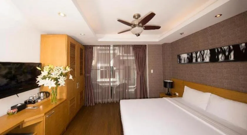 Bed in AHA Boutique Ben Thanh Hotel
