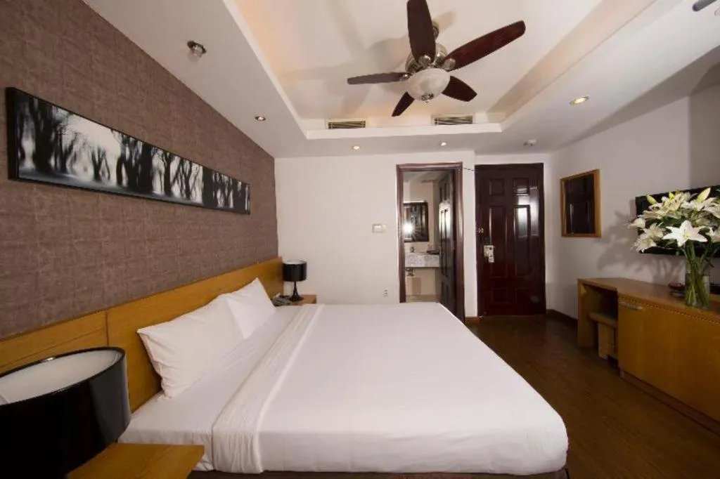 Bed in AHA Boutique Ben Thanh Hotel