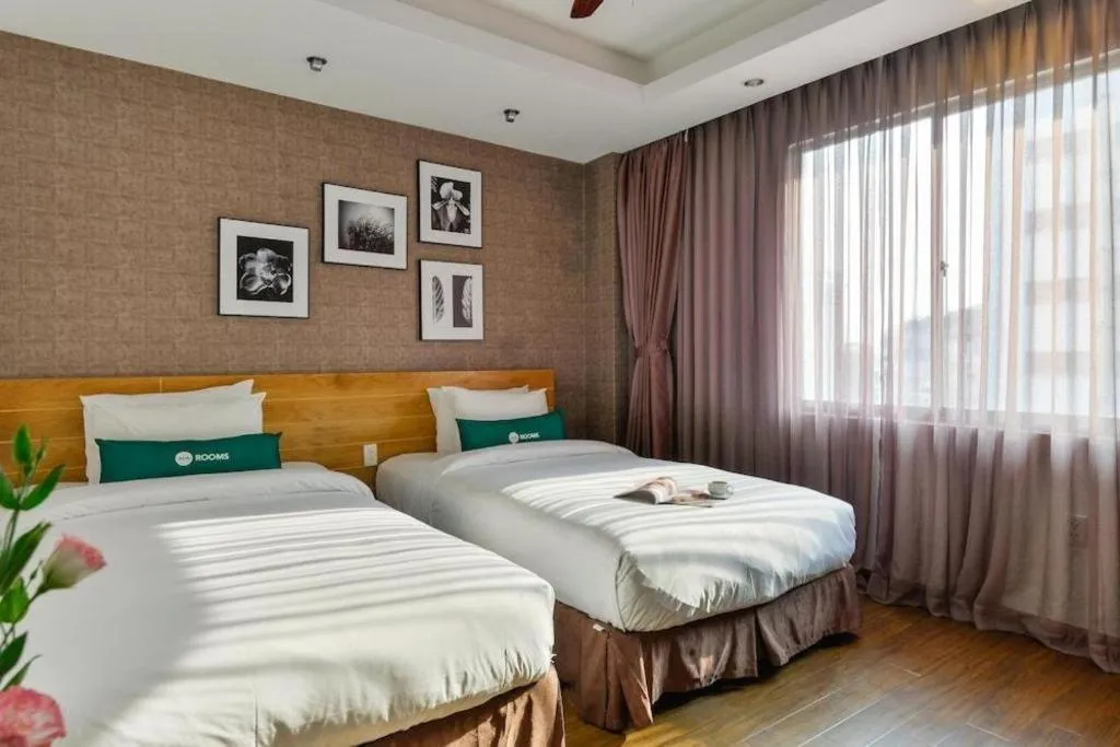 Bed in AHA Boutique Ben Thanh Hotel