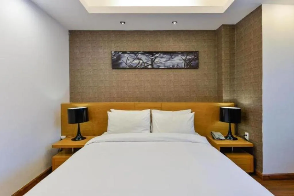 Bed in AHA Boutique Ben Thanh Hotel