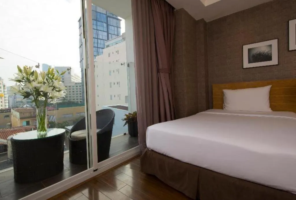 Bed in AHA Boutique Ben Thanh Hotel