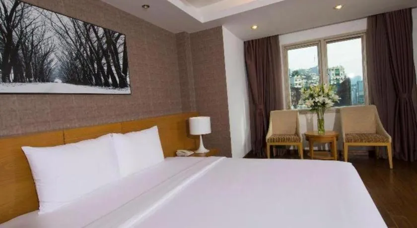 Bed in AHA Boutique Ben Thanh Hotel