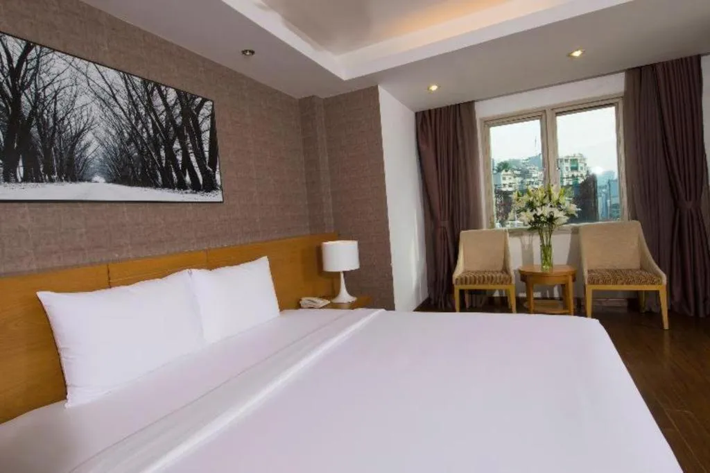 Bed in AHA Boutique Ben Thanh Hotel