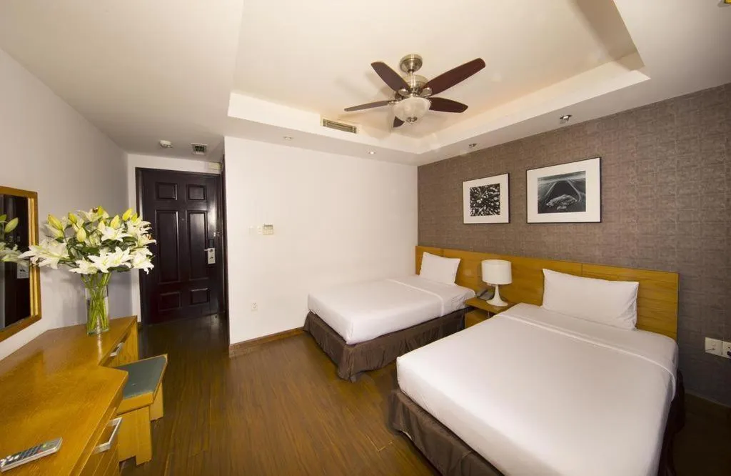 Bed in AHA Boutique Ben Thanh Hotel