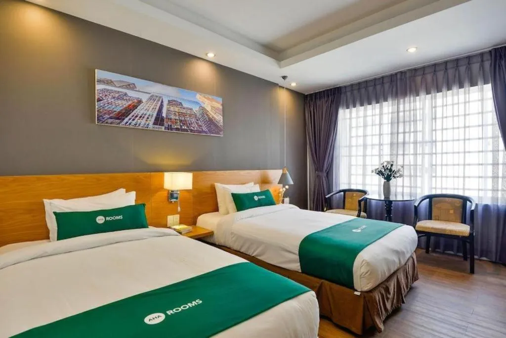 Bed in AHA Boutique Ben Thanh Hotel