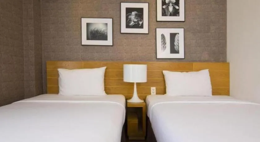 Bed in AHA Boutique Ben Thanh Hotel