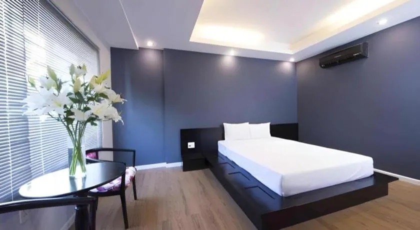 Bed in AHA Boutique Ben Thanh Hotel