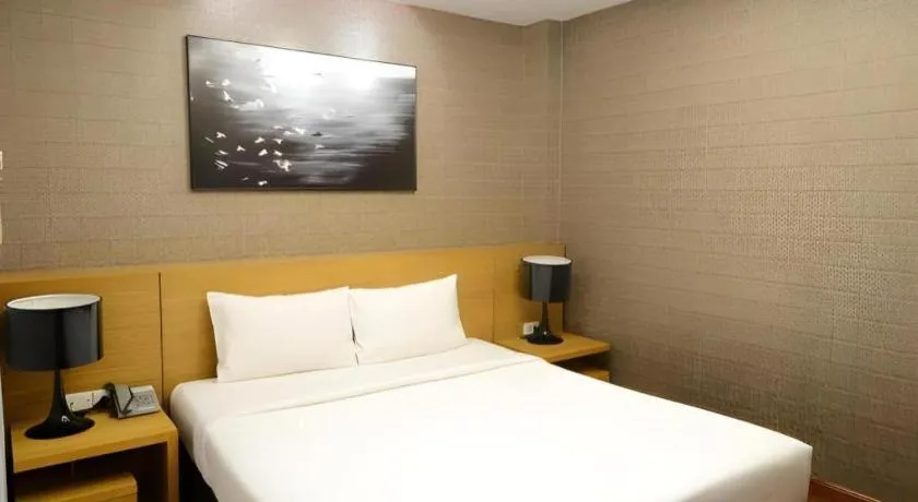 Bed in AHA Boutique Ben Thanh Hotel