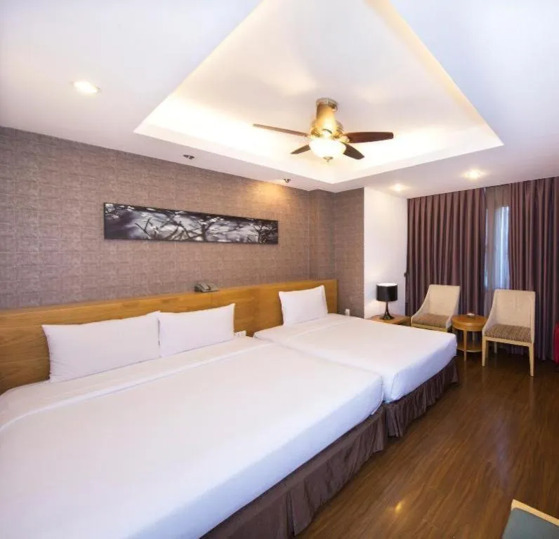Bed in AHA Boutique Ben Thanh Hotel