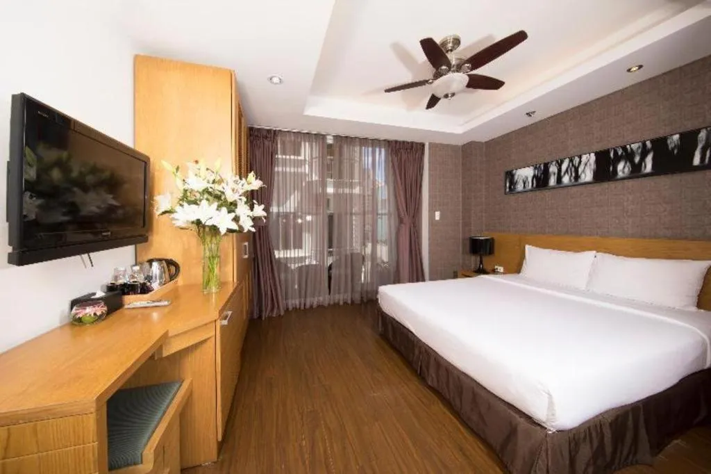 Bed in AHA Boutique Ben Thanh Hotel