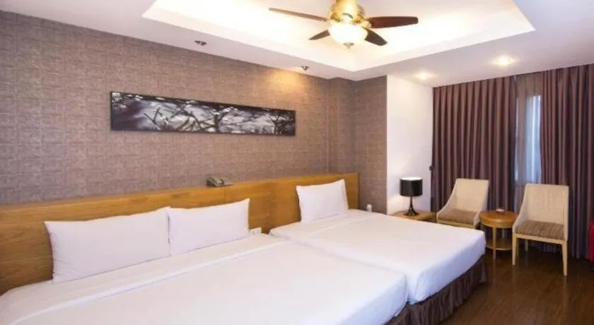 Bed in AHA Boutique Ben Thanh Hotel