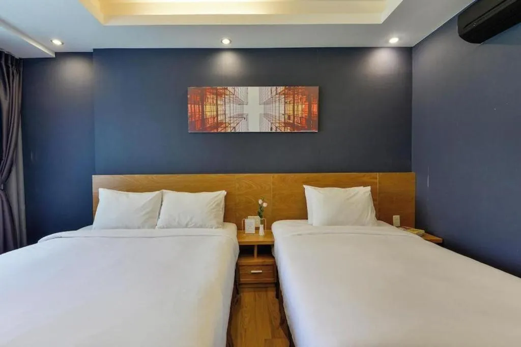 Bed in AHA Boutique Ben Thanh Hotel