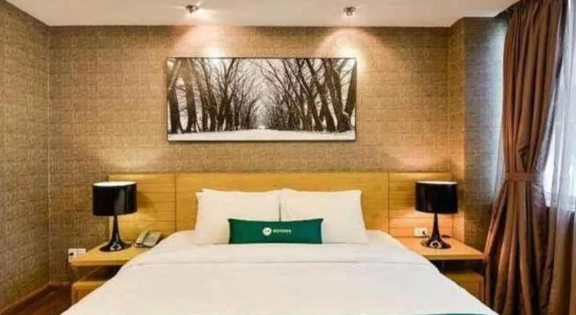 Bed in AHA Boutique Ben Thanh Hotel