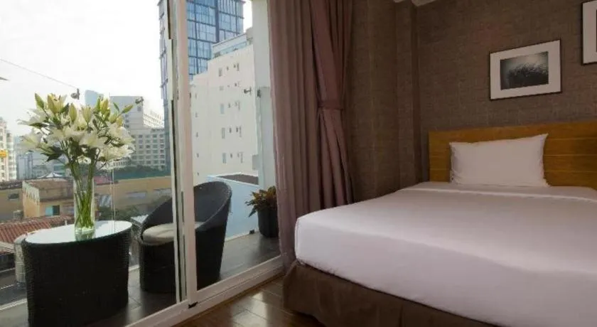 Bed in AHA Boutique Ben Thanh Hotel