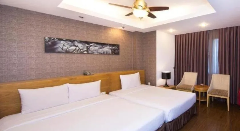 Bed in AHA Boutique Ben Thanh Hotel