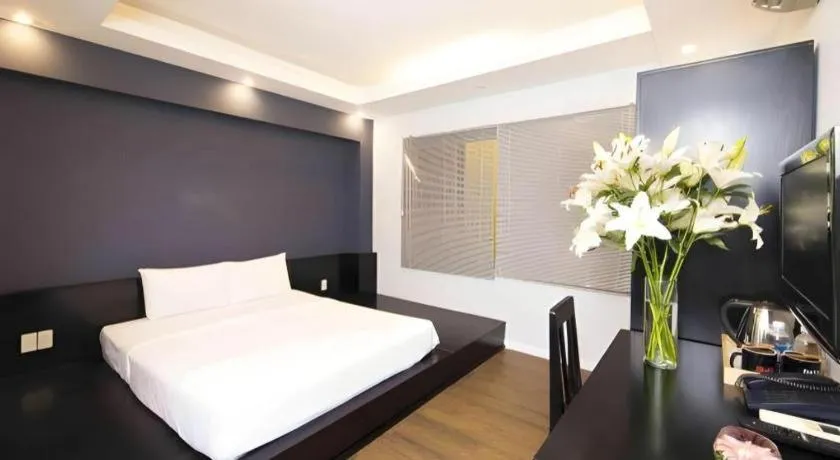 Bed in AHA Boutique Ben Thanh Hotel